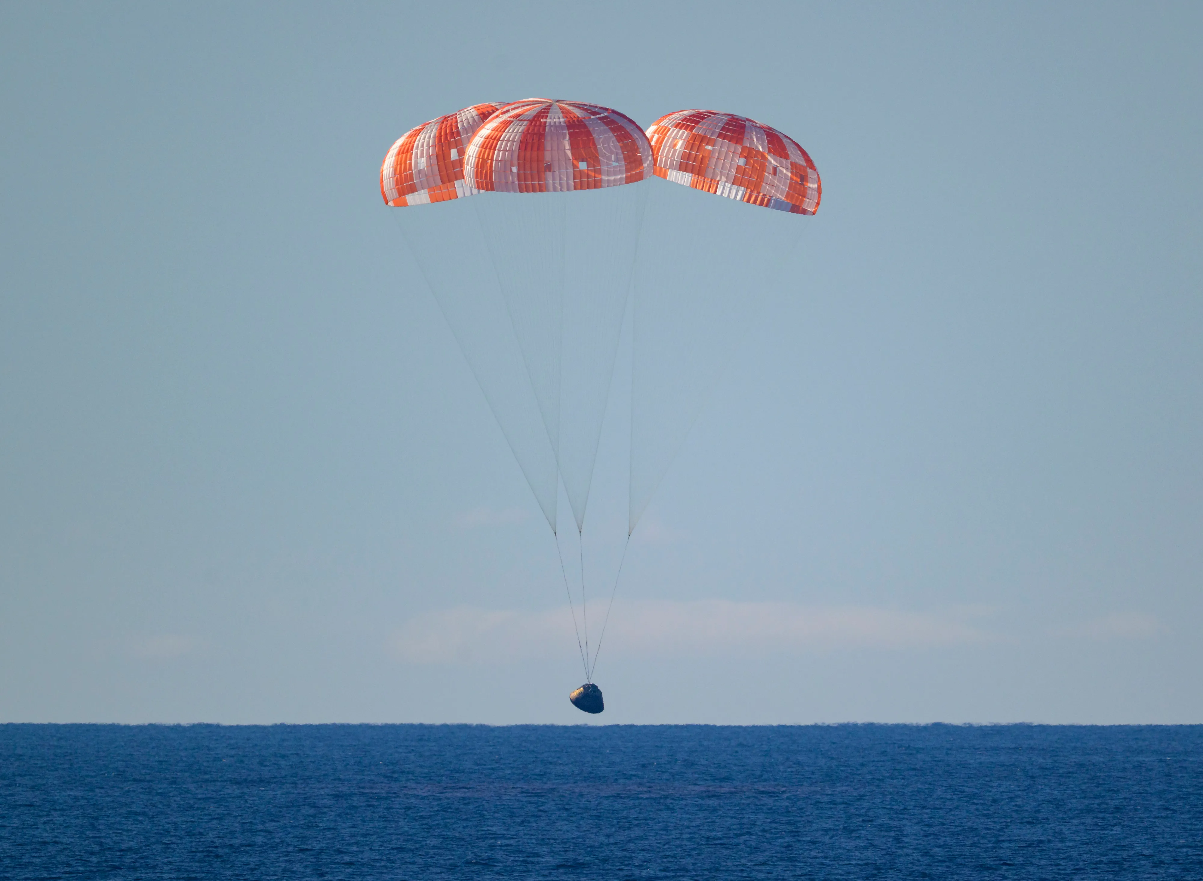 Orion under parachutes before splashdown